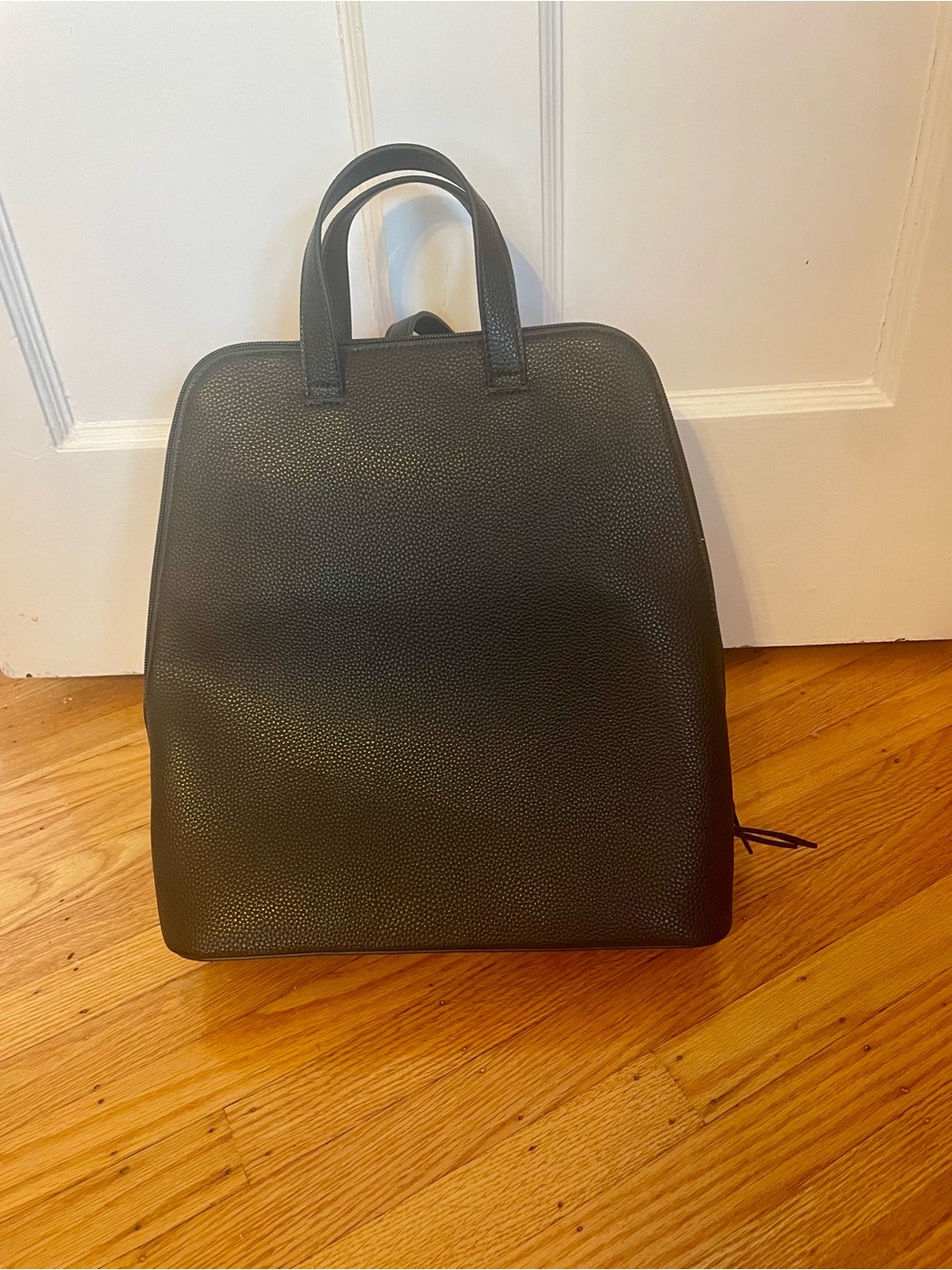 Simons black faux pebbled-leather backpack. NWT.